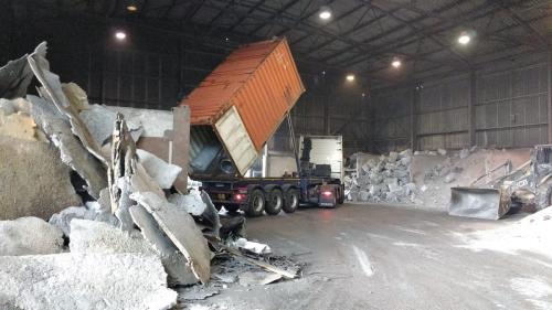 Volvo FH13 tipping a sea container import of scrap aluminium